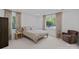 Tranquil bedroom with a comfortable bed, neutral tones, and large windows offering ample natural light at 2915 Cross Country Rd, Charlotte, NC 28270