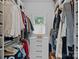 Walk-in closet with custom shelving, ample storage space, and natural light from the window at 2915 Cross Country Rd, Charlotte, NC 28270