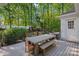 Enjoy outdoor dining on this beautiful deck with a large table and bench seating at 2915 Cross Country Rd, Charlotte, NC 28270
