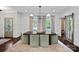 Inviting dining room featuring a large wooden table, stylish chairs and natural light from expansive windows at 2915 Cross Country Rd, Charlotte, NC 28270
