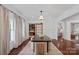 This dining room offers hardwood floors, a decorative rug, and great natural light at 2915 Cross Country Rd, Charlotte, NC 28270