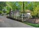 Exterior view of a beautiful house and garden enclosed by a charming white fence at 2915 Cross Country Rd, Charlotte, NC 28270
