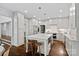 Open kitchen features a large island, stainless appliances, and white cabinetry providing ample storage at 2915 Cross Country Rd, Charlotte, NC 28270