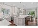 This updated kitchen has stainless appliances, an island, and seating at 2915 Cross Country Rd, Charlotte, NC 28270