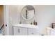 Bathroom vanity featuring a stylish round mirror and modern faucet at 314 Bass Ln, Charlotte, NC 28270