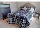 Bedroom featuring a black and white patterned bed and modern furnishings at 314 Bass Ln, Charlotte, NC 28270