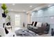 Spacious living room with blue accent wall, a comfortable sofa, and modern decor at 314 Bass Ln, Charlotte, NC 28270