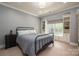 Serene bedroom with built-in shelves, soft lighting, and a comfortable bed, perfect for relaxation and rejuvenation at 3160 Ashwood Park Dr, Belmont, NC 28012