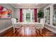 Bright dining room with modern lighting, hardwood floors, windows, and artwork at 3160 Ashwood Park Dr, Belmont, NC 28012