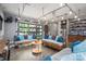 Garage featuring two couches, glass garage door, and ample lighting at 3160 Ashwood Park Dr, Belmont, NC 28012