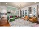 Bright living room with modern lighting, hardwood floors, and sliding doors to the yard at 3160 Ashwood Park Dr, Belmont, NC 28012