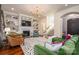 Bright living room featuring built-in bookshelves, a fireplace, and stylish decor at 3160 Ashwood Park Dr, Belmont, NC 28012