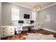 Spacious home office with custom built-in desk, ample storage, and stylish decor at 3160 Ashwood Park Dr, Belmont, NC 28012