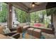 Inviting screened-in porch with cozy seating, ceiling fan, and a tranquil view of the outdoors at 3160 Ashwood Park Dr, Belmont, NC 28012