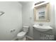 Bathroom featuring modern sink, toilet, and shower-tub combo at 3320 Alderknoll Ct, Charlotte, NC 28216