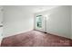 Bedroom with a lamp and carpet at 3320 Alderknoll Ct, Charlotte, NC 28216