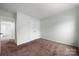 Bedroom boasts neutral paint, carpet, and a closet at 3320 Alderknoll Ct, Charlotte, NC 28216