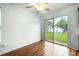 Bright dining area with wood floors, a sliding glass door, and backyard views at 3320 Alderknoll Ct, Charlotte, NC 28216