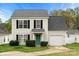 Charming two-story home with black shutters, a green front door, and an attached one-car garage at 3320 Alderknoll Ct, Charlotte, NC 28216