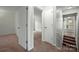 Hallway featuring carpet and multiple doorways at 3320 Alderknoll Ct, Charlotte, NC 28216
