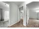 Hallway with bathroom on left and bedroom at end at 3320 Alderknoll Ct, Charlotte, NC 28216