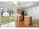 Eat in kitchen with wood cabinets and stainless appliances that lead to a backyard at 3320 Alderknoll Ct, Charlotte, NC 28216