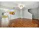 A view of the living room with hardwood floors that opens to the kitchen at 3320 Alderknoll Ct, Charlotte, NC 28216