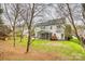 Spacious backyard featuring a screened-in porch and a well-manicured lawn, ideal for outdoor enjoyment at 3383 Norwich Rd, Fort Mill, SC 29715