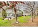 Expansive backyard with a screened porch, patio seating, and well-maintained lawn offers a relaxing outdoor space at 3383 Norwich Rd, Fort Mill, SC 29715