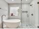Modern bathroom featuring a freestanding tub and a glass-enclosed shower at 3383 Norwich Rd, Fort Mill, SC 29715
