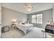 Bright bedroom offers soft carpet, ceiling fan and a large window, with ample natural light at 3383 Norwich Rd, Fort Mill, SC 29715