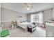 bedroom with a large window, white trim, ceiling fan and ample storage at 3383 Norwich Rd, Fort Mill, SC 29715