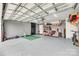 Spacious garage with gray walls, epoxy floors, storage shelves, and ample workspace at 3383 Norwich Rd, Fort Mill, SC 29715