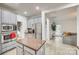 Open-concept kitchen with an island, stainless steel appliances, and a seamless connection to the living area at 3383 Norwich Rd, Fort Mill, SC 29715