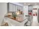 Well-lit kitchen with gray cabinetry, neutral countertops, and modern stainless steel appliances at 3383 Norwich Rd, Fort Mill, SC 29715