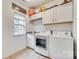 Well-lit laundry room with modern washer, dryer, and ample storage space at 3383 Norwich Rd, Fort Mill, SC 29715