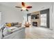Cozy living room boasts a fireplace with wood slat surround and a plush sectional couch at 3383 Norwich Rd, Fort Mill, SC 29715