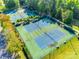 Aerial view of well-maintained tennis courts surrounded by lush greenery, providing an active recreational space at 3383 Norwich Rd, Fort Mill, SC 29715