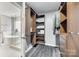 Organized walk-in closet with custom shelving and a view of the modern bathroom at 3383 Norwich Rd, Fort Mill, SC 29715