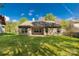 Backyard view of home featuring a covered patio and grassy area at 3411 Xandra Ct, Indian Land, SC 29707