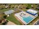 Aerial view of the pool and tennis courts with lush greenery in the community at 3411 Xandra Ct, Indian Land, SC 29707