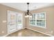 Bright dining area with access to outdoor patio space through glass panel door at 3411 Xandra Ct, Indian Land, SC 29707