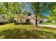 Lovely single-story home featuring a lush green lawn and mature trees in a serene setting at 3411 Xandra Ct, Indian Land, SC 29707