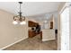 The cozy kitchen features tile floors, wood cabinets, and black appliances at 3411 Xandra Ct, Indian Land, SC 29707