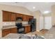 Kitchen features laminate countertops, wood cabinets, and practical appliances at 3411 Xandra Ct, Indian Land, SC 29707