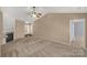 Spacious living room features neutral tones, a fireplace, and a ceiling fan at 3411 Xandra Ct, Indian Land, SC 29707