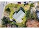 Aerial view of home with mature trees, a gray roof, and a large green yard, nestled in a neighborhood at 394 Efird St, Gastonia, NC 28054