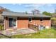 Brick home with a concrete patio and fenced yard, ideal for outdoor entertaining and relaxation at 394 Efird St, Gastonia, NC 28054
