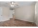 A bright bedroom shows wood-look flooring and ceiling fan at 394 Efird St, Gastonia, NC 28054