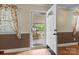 Inviting entryway with natural light streaming through the decorative front door and windows at 394 Efird St, Gastonia, NC 28054